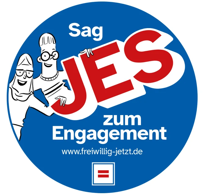 Rundes Logo in blau mit zwei Comicfiguren und der Aufschrift "Sag JES zum Engagement www.freiwillig-jetzt.de".